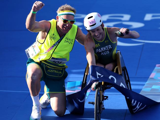 PARIS, FRANCE - SEPTEMBER 02: Lauren Parker of Team Australia celebrates victory in the Women's PTWC Para Triathlon on day five of the Paris 2024 Summer Paralympic Games at Pont Alexandre III on September 02, 2024 in Paris, France. (Photo by Tasos Katopodis/Getty Images)