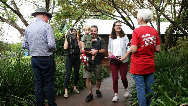 Member for Kiama Gareth Ward (left) campaigning at Mount Terry Public School as Labor candidate Katelin McInerney turns up to vote with partner Brian Fearnley and son William. Picture: Jane Dempster