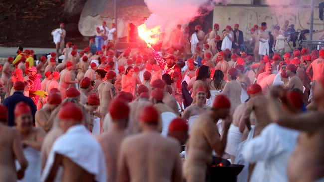 Swimmers return to shore to dry off and warm up after their quick dip. Picture: SAM ROSEWARNE