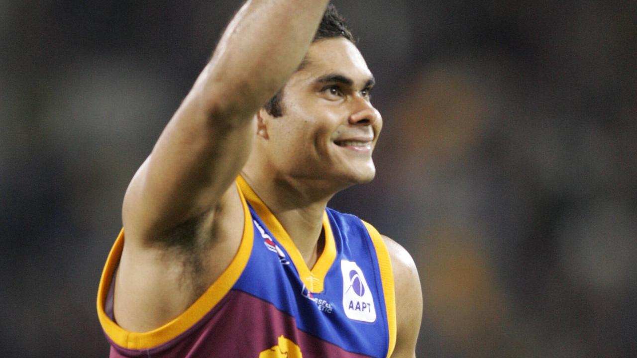 Mal Michael celebrates 150 games for the Lions.Lions V Adelaide at the Gabba. pics David Kelly.24.7.04. AFL