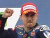 MotoGP raider Jorge Lorenzo of Spain celebrates his victory on the podium, next to 2nd placed Aleix Espargaro, left, and Cal Crutchlow of Great Britain, right, at the Aragon Motorcycle Grand Prix in Alcaniz, Spain, Sunday, Sept. 28, 2014. (AP Photo/Manu Fernandez)