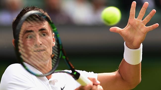 Bernard Tomic in action at Wimbledon. Photo by Shaun Botterill/Getty Images