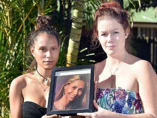 UNANSWERED QUESTIONS: Minnie Clubb and Nikki Duncan with photos of their sister and sister-in-law Monique Clubb, who went missing two years ago. Picture: Alistair Brightman