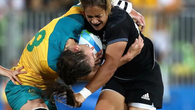 Chloe Dalton cops some underhand defence from New Zealand’s Kayla McAlister in women’s rugby sevens Olympic final in Rio. Picture: Getty Images.