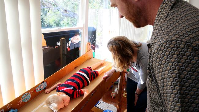 Roki, 3, does his exercises on a special ramp. Picture: Troy Snook