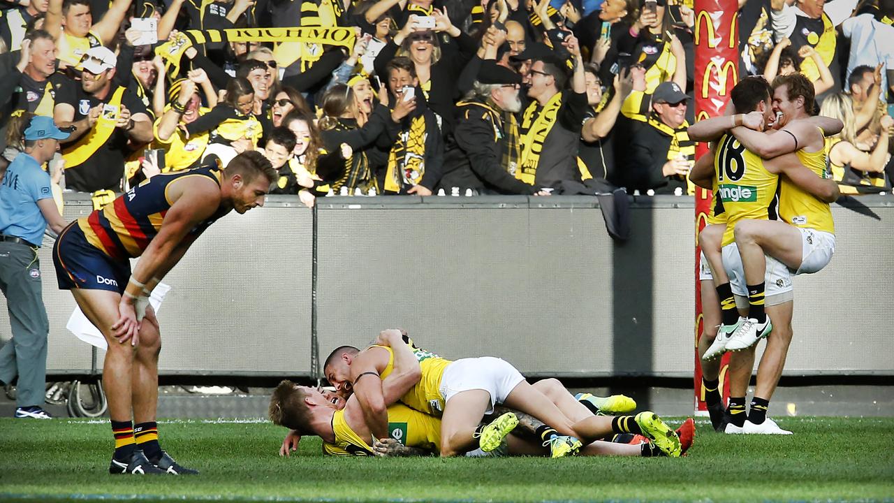 Daniel Talia is defected as Richmond players celebrate the final siren of the 2017 AFL Grand Final. Picture: David Caird