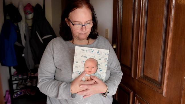 Julie-Ann Nottle poses for photographs with a photograph of her baby boy Joshua Nottle. Pictured in 2018. Picture: Tracey Nearmy/The Australian