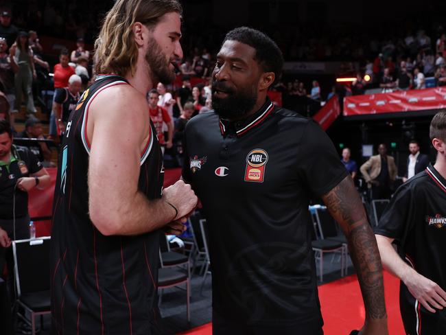 WOLLONGONG, AUSTRALIA - MARCH 05: Hawks head coach Justin Tatum celebrate winning with Sam Froling during game three of the NBL Semi Final Series between Illawarra Hawks and South East Melbourne Phoenix at WIN Entertainment Centre, on March 05, 2025, in Wollongong, Australia. (Photo by Matt King/Getty Images)