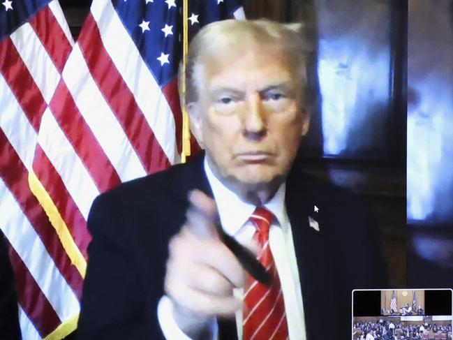 US President-elect Donald Trump appears remotely for a sentencing hearing in front of New York State Judge Juan Merchan in the criminal case in which he was convicted in 2024 on charges involving hush money paid to a porn star, at New York Criminal Court in Manhattan in New York City, on January 10, 2025. A judge sentenced Donald Trump to an unconditional discharge Friday for covering up hush money payments to a porn star despite the US president-elect's last-ditch efforts to avoid becoming the first felon in the White House. (Photo by Brendan McDermid / POOL / AFP)