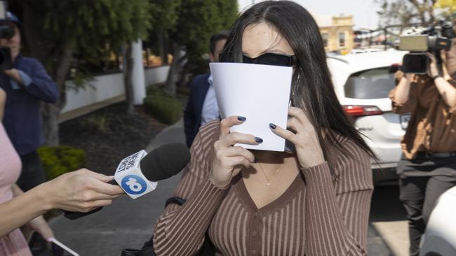 Constable Kelly Calicchio leaves Port Adelaide Magistrates Court after her first appearance. Picture: Brett Hartwig