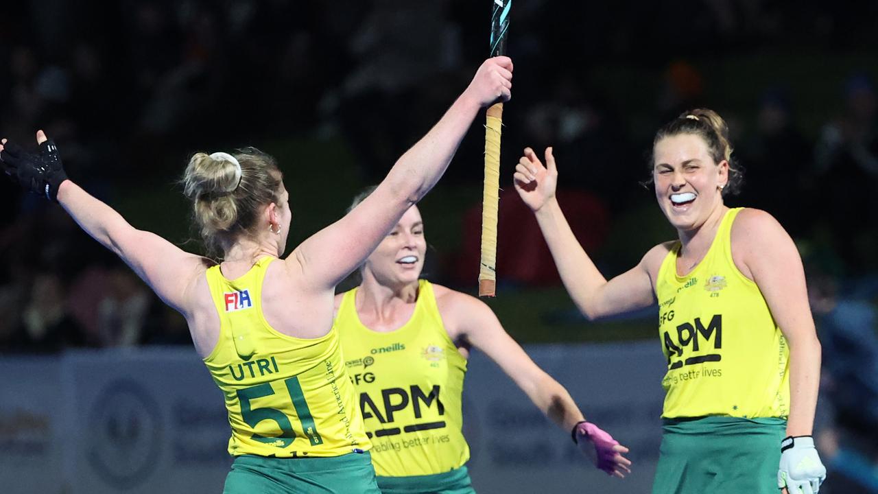 Ash Utri celebrates with teammates. Picture: David Mariuz/ Hockey Australia