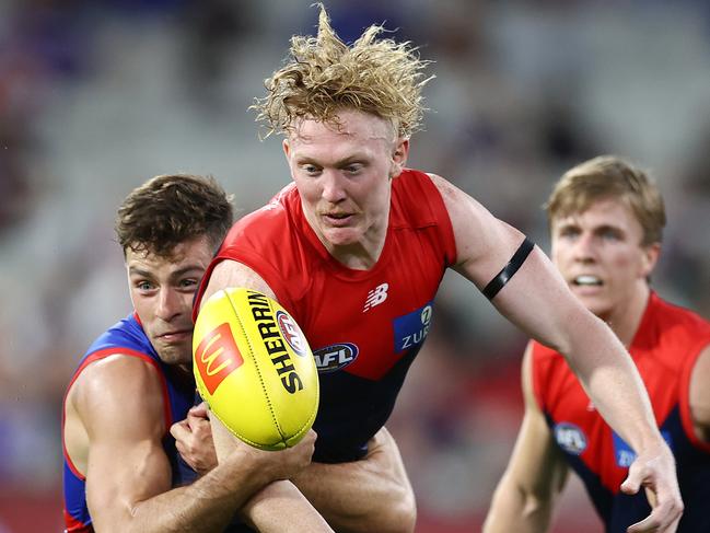 Josh Dunkley — as a Bulldog — gets a tackle on Clayton Oliver. Picture: Michael Klein