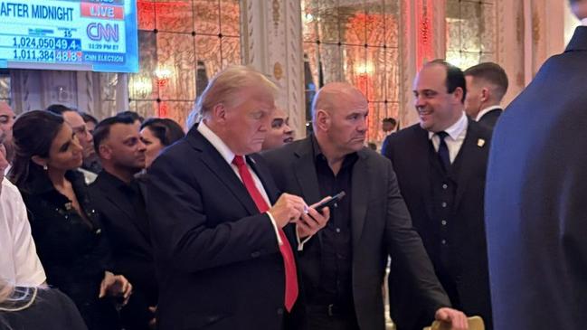 Donald Trump working his phone while watching the results come in on Fox News. Picture X