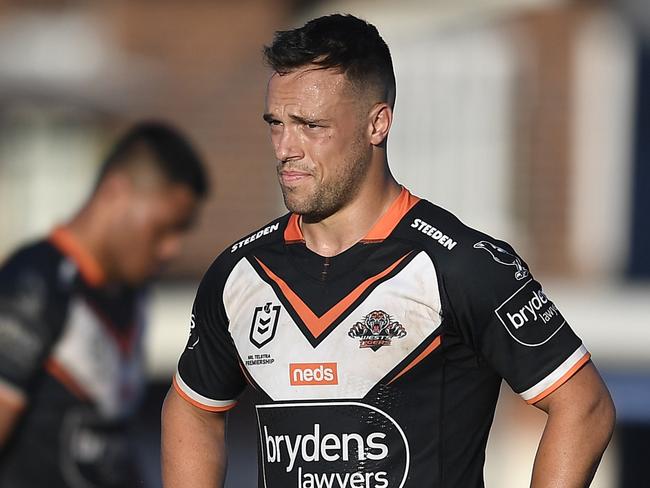 ROCKHAMPTON, AUSTRALIA - AUGUST 21:  Luke Brooks of the Tigers looks dejected after losing the round 23 NRL match between the Wests Tigers and the Cronulla Sharks at Browne Park, on August 21, 2021, in Rockhampton, Australia. (Photo by Ian Hitchcock/Getty Images)