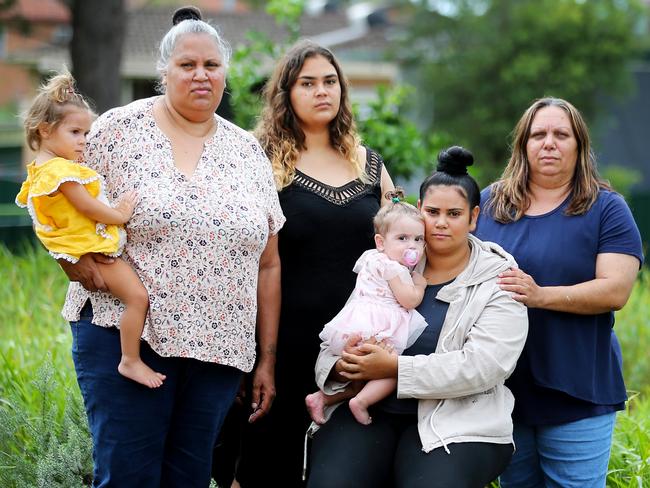 Relatives of murdered four-year-old Evelyn Greenup gather at the memorial park in Bowraville: Michelle Jarrett holding Lahinya Stadhams (l to r), Yaara Straede, Lytiah Stadhams holding Lahwana Stadhams and aunt Penny Stadhams.