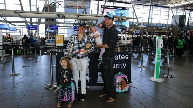 Anna and Greg Glide with their children Shanelle and Taylor at Sydney Domestic Airport (T2) on Monday morning. Picture: NCA Newswire