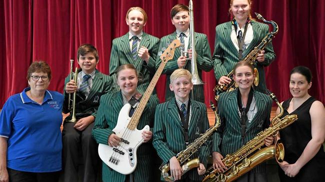 SWEET SOUND: Jeanette Douglas (musical director, Cap Winds) with TCC students Lachlan Andersen, Lachlan Winter, Jayde Ellingsen, Angus Gall, Oliver Burkhardt, Georgia Slack, Acacia-Lee Storey, and Stephanie Coughlan (acting director instrumental music, Catholic schools) look forward to Fusion 2019. Picture: Jann Houley