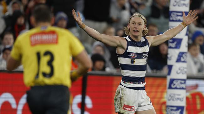 Geelong wingman Ollie Dempsey wins a free kick directly in front of goal after Essendon’s Jye Menzie was penalised for a deliberate rushed behind. Picture: Michael Klein