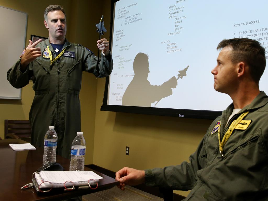 Australian Pilots training in the F35 fighter Jets Luke Airforce Base in Phoenix Arizona. Squadron leader Wing Commander Darren Clare (L) briefs Flight Lieutenant “Damo” before a flight . Picture: Nathan Edwards