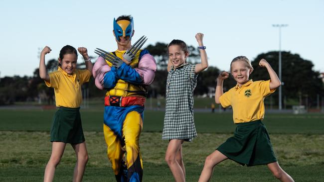 Maroubra dad Tasman Cassim with (from left) his daughter Maeya Cassim, 9, and school mates Frankie Gibson, 9, and Indie Heron, 8. Picture: Monique Harmer