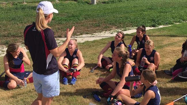 BSHS coach Natasha Adams addresses her team during halftime in the QGSSSA top of the table clash between BSHS and BGGS.