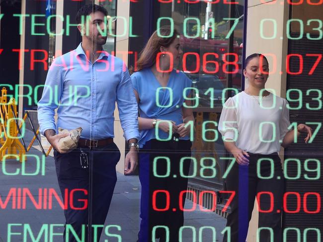 ????SYDNEY, AUSTRALIA : NewsWire Photos - FEBRUARY 24 2025; A general view of people walking past the digital boards of the ASX in the Sydney CBD. Picture: NewsWire/ Gaye Gerard