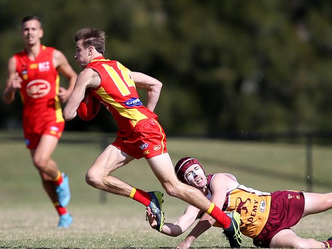 August 16, Gold Coast, Queensland - Gold Coast Suns Academy player Max Pescud (#14) in action against the Brisbane Lions at Labrador during the VFL NAB League. Scott Powick Newscorp