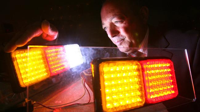 Tony Ottobre shows off the LED lights his company manufactured for trucks in a 2009 file photo.