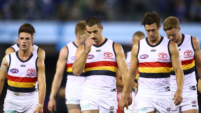 Adelaide trudges off after a horro outing against North Melbourne on Saturday. Picture: Scott Barbour/Getty Images.