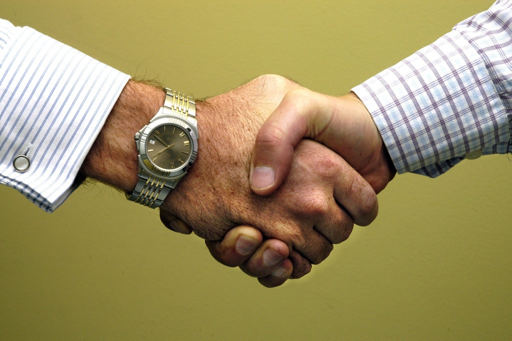 Two men shaking handsPhoto: John McCutcheon / Sunshine Coast Daily. Picture: john mccutcheon