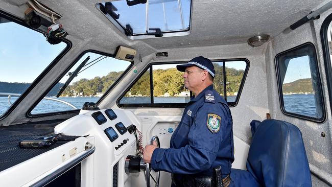 HORNSBY ADVOCATE/AAP. Sergeant David Lowden on the Hornsby Police boat at Brooklyn on Tuesday, May 14. Ku-Ring-Gai Police have a few officers who patrol the Hawkesbury River a couple of times a week, serving the remote communities on the river. AAP IMAGE / Troy Snook)