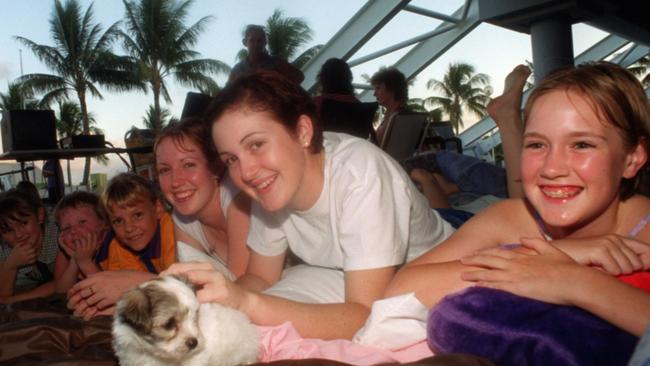 APRIL 27, 2001 : L-R Morgan Osborne, Hayden Collins, Emily Collins, Hayley Hinspeter, Lisa Kingsberry, Kylie Hinspeter & Toby the dog camped outside Townsville Entertainment Centre 27/04/01 in bid to secure tickets to NBL grand final game 3 Crocodiles v Wollongong Hawks. Pic Lori Neilsen. Basketball / Fan