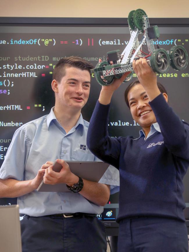 St Patrick’s Technical College students Alicia, 15, and Alex, 17, coding instructions for a robot. Picture: AAP / Dean Martin