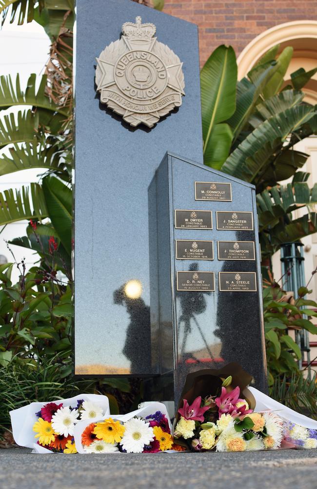 Flowers outside Toowoomba police station. Picture: AAP/Sarah Motherwell