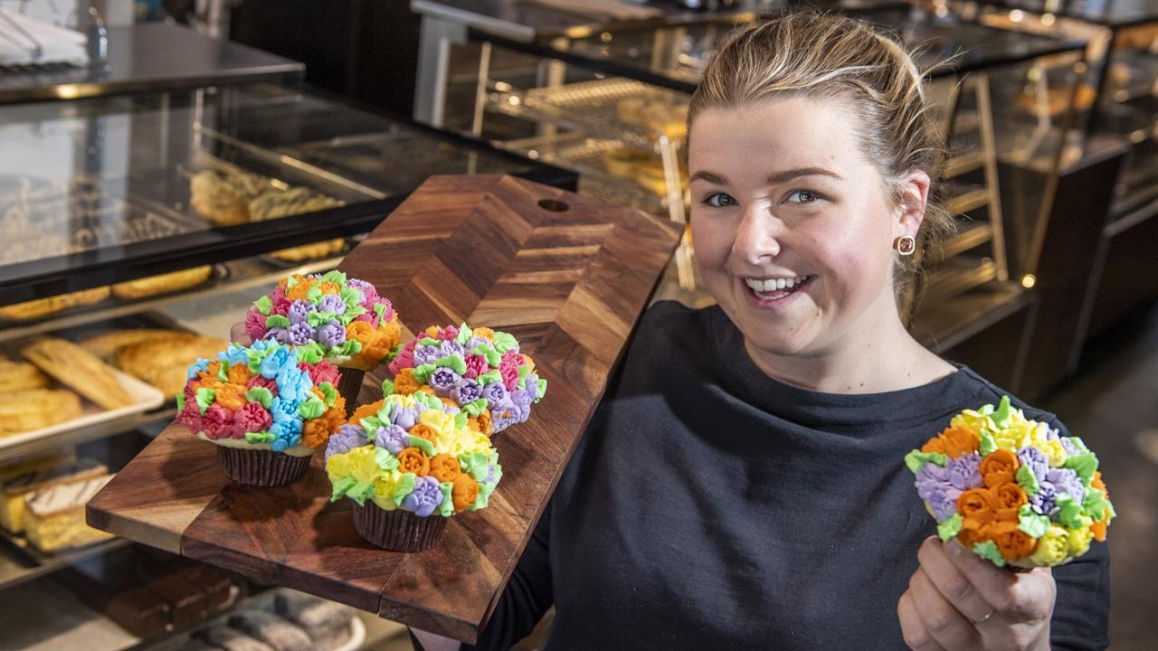 Zara Warby from CC's on the Range Bakehouse with some of their tasty carnival of flowers themed cupcakes. Wednesday, September 15, 2021. Picture: Nev Madsen.