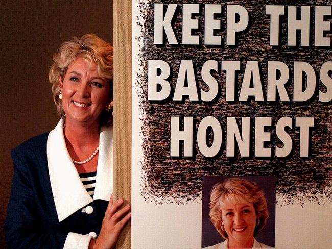 Former Australian Democrats leader Cheryl Kernot beside the 1996 federal election campaign poster bearing the famous slogan “Keep the Bastards Honest”. 