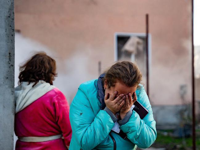 A woman reacts in the courtyard of a damaged building following a missile attack at an undisclosed location in Odessa region. Picture: AFP