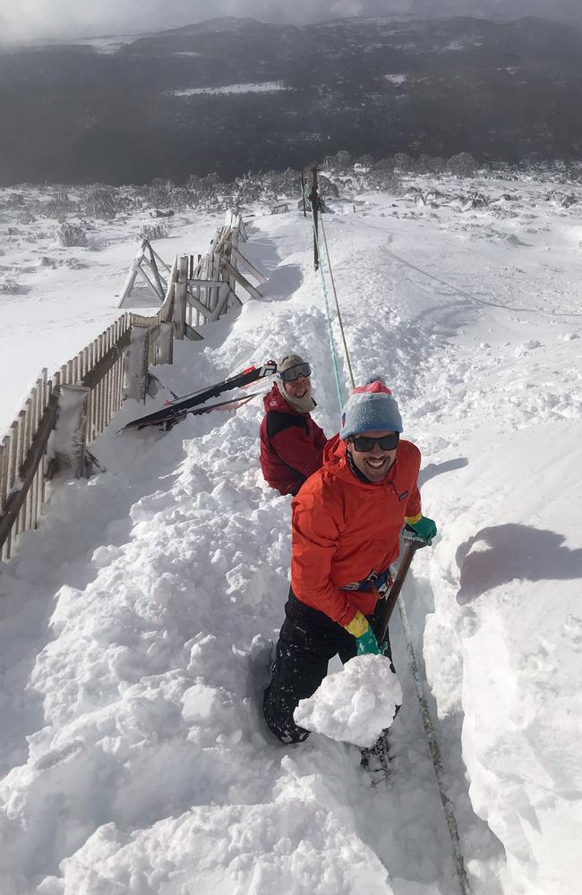 Heavy overnight snow at Mt Mawson ski field in Mt Field National Park covered over the tow rope, and volunteers had to dig it clear. Picture: Peter Davis