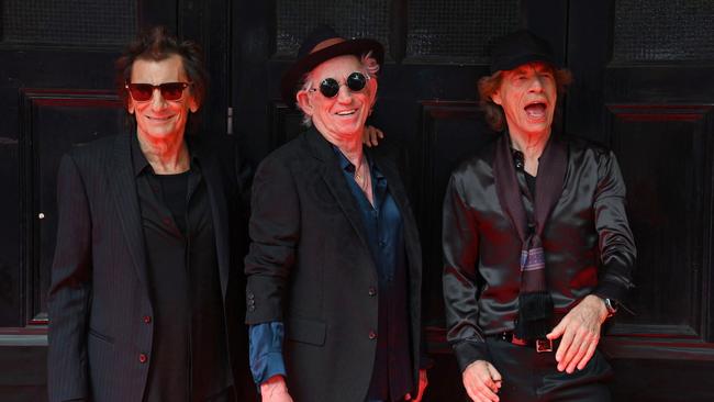 Ron Wood, Keith Richards and Mick Jagger of legendary British rock band, The Rolling Stones pose as they arrive to attend a launch event for their new album, "Hackney Diamonds" on September 6, 2023. (Photo by Daniel LEAL / AFP)