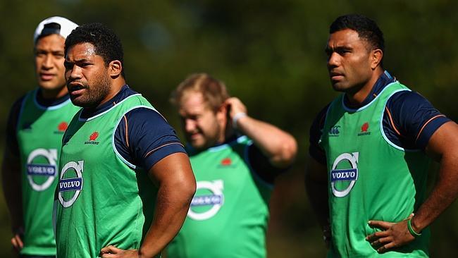 SYDNEY, AUSTRALIA - MAY 01: Tatafu Polota-Nau of the Waratahs (L) and team mates look on during a Waratahs Super Rugby training session at Kippax Lake on May 1, 2014 in Sydney, Australia. (Photo by Cameron Spencer/Getty Images)