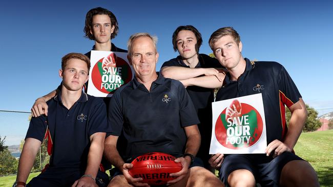 Guilford Young College school teacher Blair Brownless, centre, discusses the Save Our Footy campaign with Guilford Young year 12 students, from left, Patrick Kelly, Hudson Wakefield, Riley Oakley and Lachlan Gadomski. Picture: LUKE BOWDEN