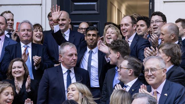 Sunak waves as he is greeted by colleagues at the Conservative Party Headquarters after having been announced as the winner of the Conservative Party leadership contest on October 24.