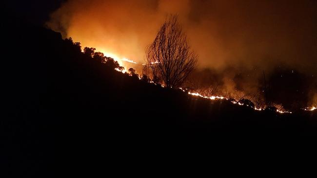 Fire threatens homes in Widgee in late November last year. Pictures: The Palms Rural Fire Brigade