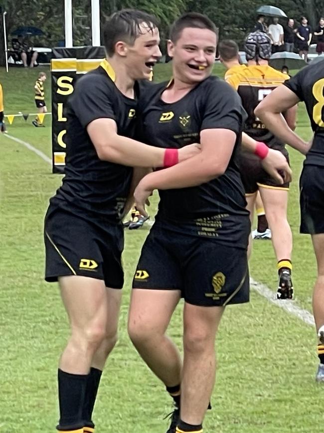 St Laurence's College winger Brody McLaren celebrates his try.