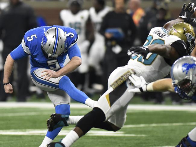 Detroit Lions kicker Matt Prater, pressured by Jacksonville Jaguars cornerback Jalen Ramsey misses the point after an attempt.