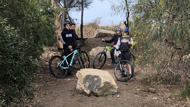 Harry, 13, of Point Cook with his mates near the Alamanda Estate where the council placed boulders to stop the path from being used by mountain bikes.