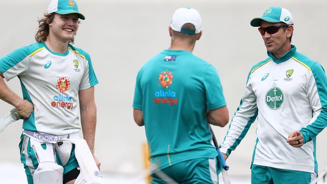 Justin Langer speaks with Will Pucovski and David Warner at the SCG on Wednesday Picture: Getty Images