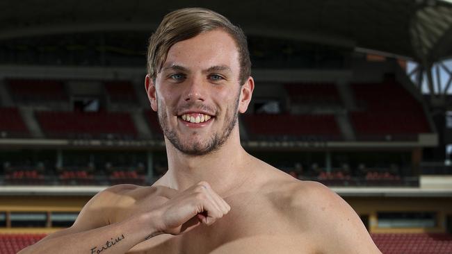 SA hero: Olympian Kyle Chalmers shows off his Olympic Tattoos on his return from Rio. Picture Sarah Reed