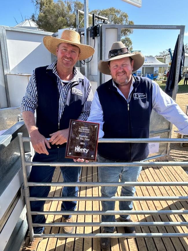 Bob Thornely and Simon Flinn of Flinn Designs at The Rock in southern NSW win the Henty Machinery Field Days Machine of the Year award with their ergonomically designed automated catching pen. Picture: Nikki Reynolds