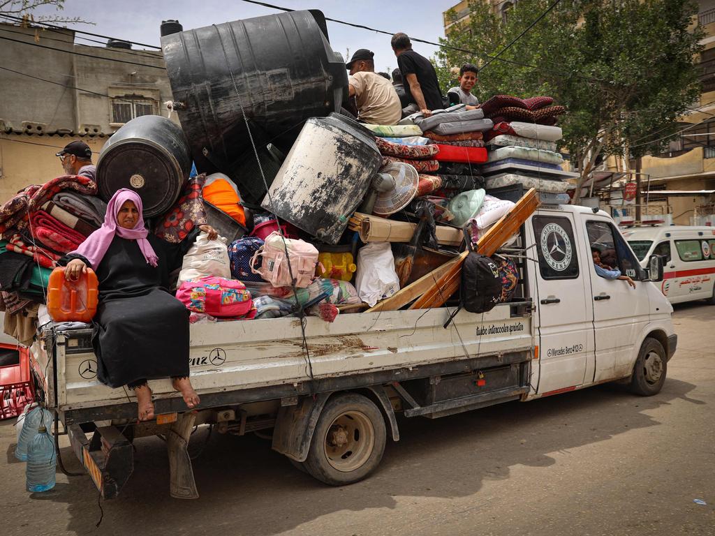 Palestinians pile their belongings on a truck as it drives to safer areas in Rafah, in the southern Gaza Strip. Picture: AFP